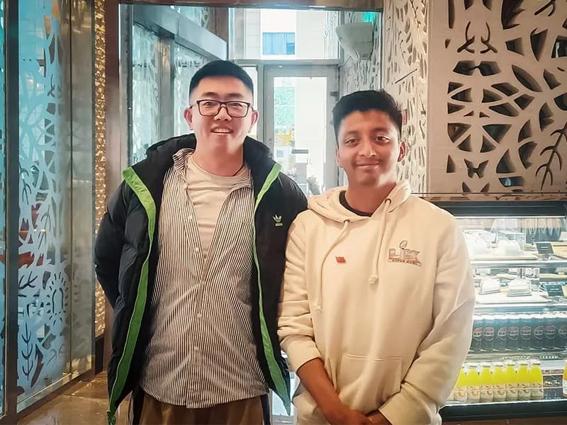 Uncle Zhao meeting Ivan from the United States during his China trip in Beijing